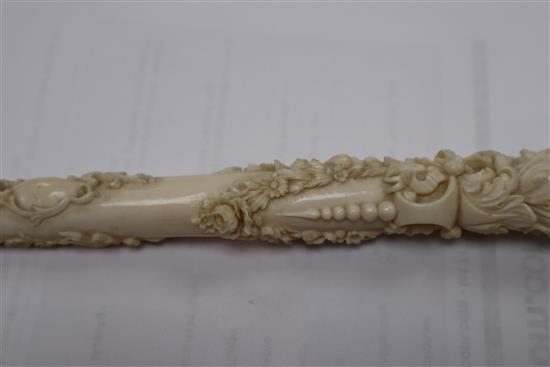 A 19th century Dieppe carved ivory parasol handle length 27.5cm